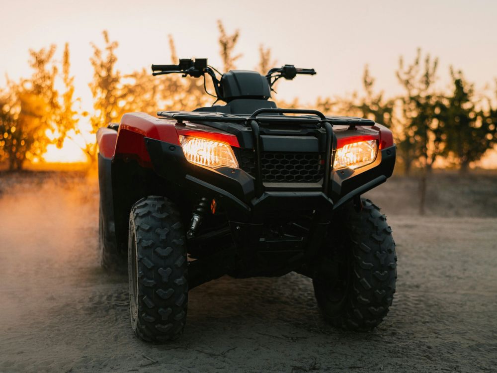 Red ATV at sunset