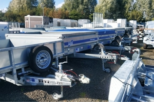 A row of silver VIN Chip marked Trailers