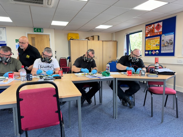 Nick Mayell leading a training session in a classroom setting.