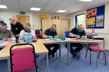 Nick Mayell leading a training session in a classroom setting.
