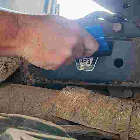 A VIN CHIP tamper-evident warning label being applied to a vehicle as part of security measures.