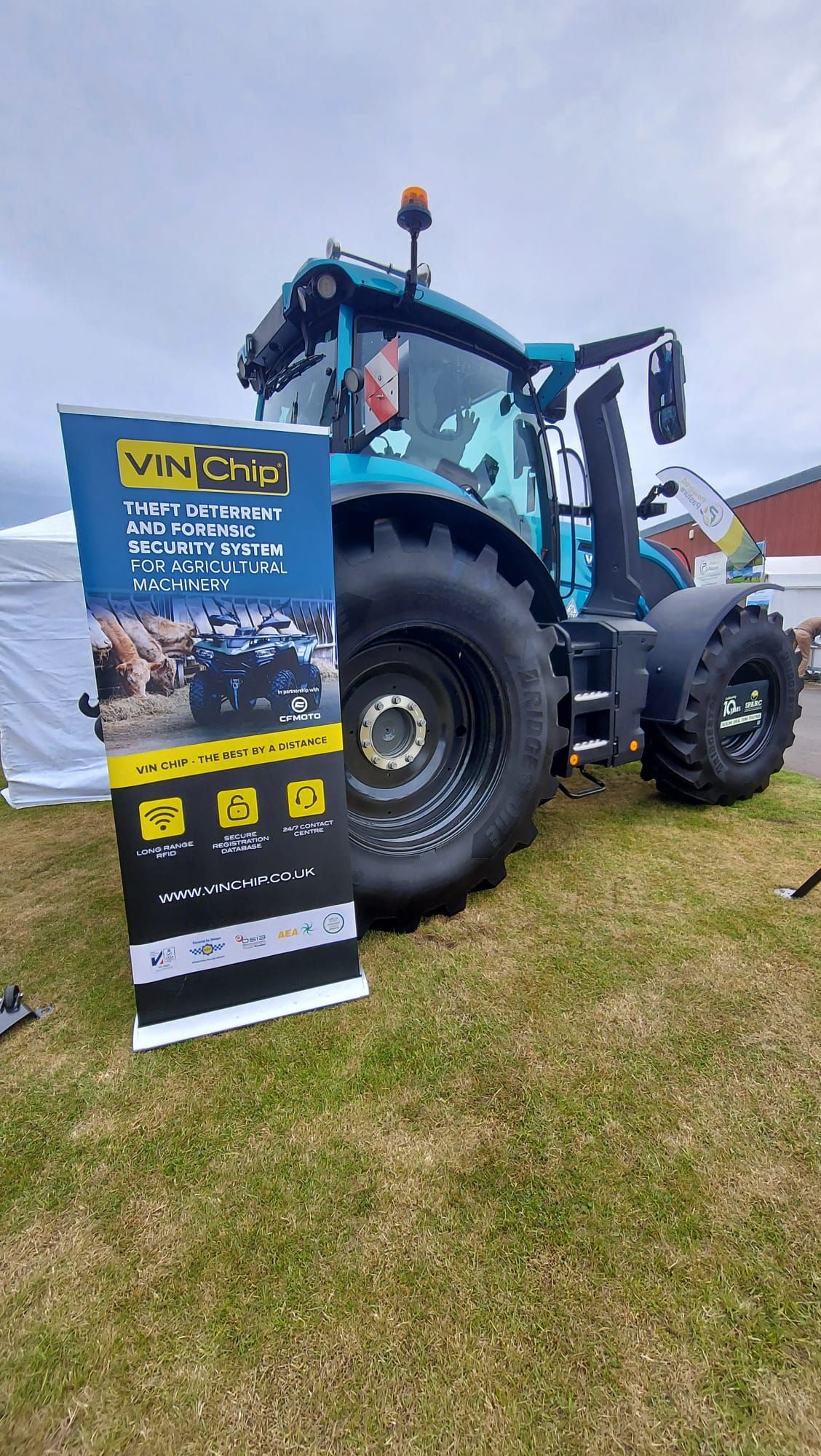 Agricultural tractor displayed alongside the VIN Chip banner at the Royal Highland Show 2026.