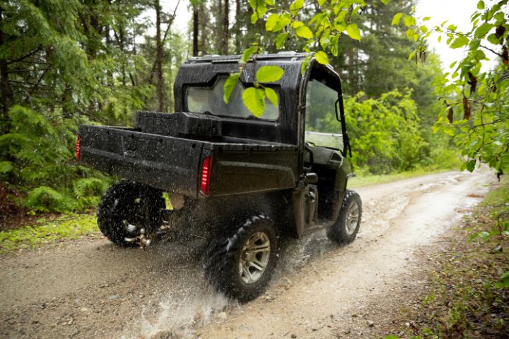 Small VIN Chip Protected UTV Being Driven On Country Estate Grounds
