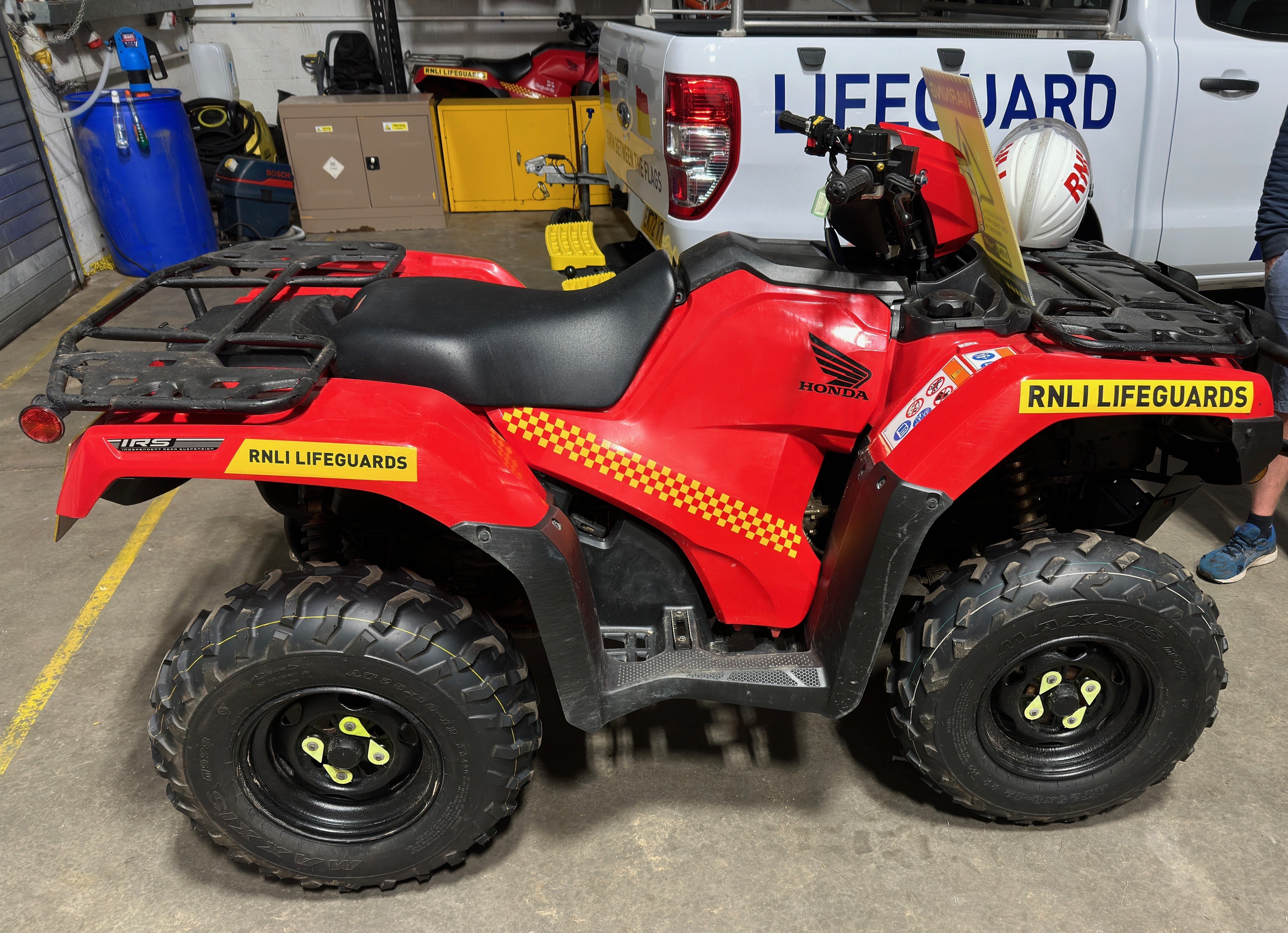 RNLI red Honda quadbike used for beach patrol and lifesaving operations on Merseyside
