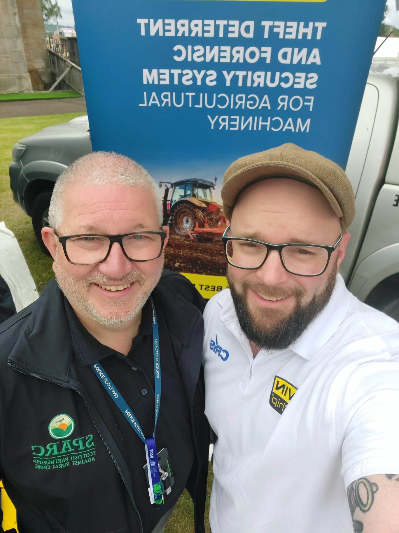 Stuart Ward of Scottish Partnership Against Rural Crime (SPARC) and Mike Morton of VIN Chip at the Royal Highland Show 2026 in front of the VIN Chip banner.